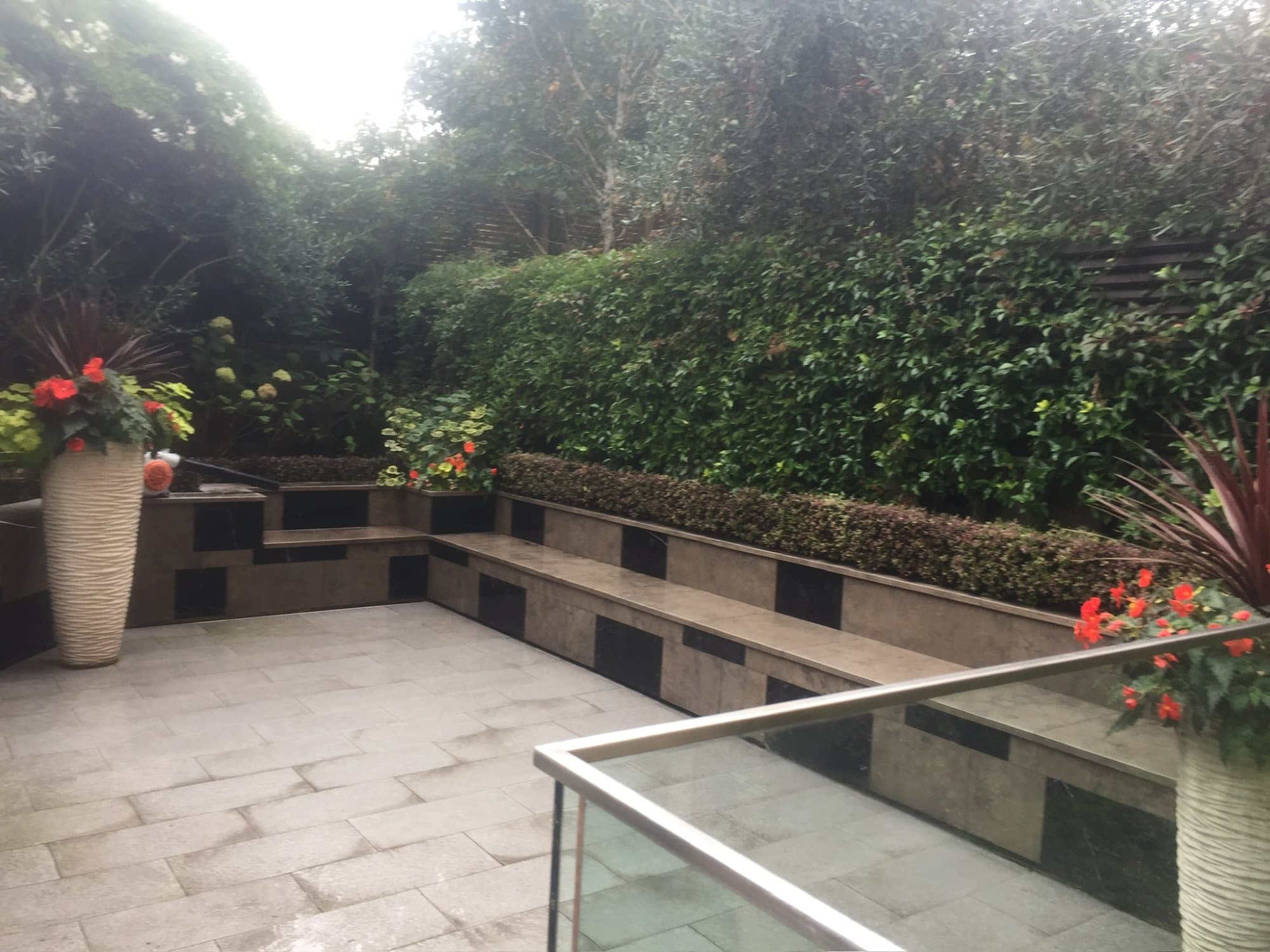 A small paved courtyard garden — the kind of considered small space that inspired this journal post