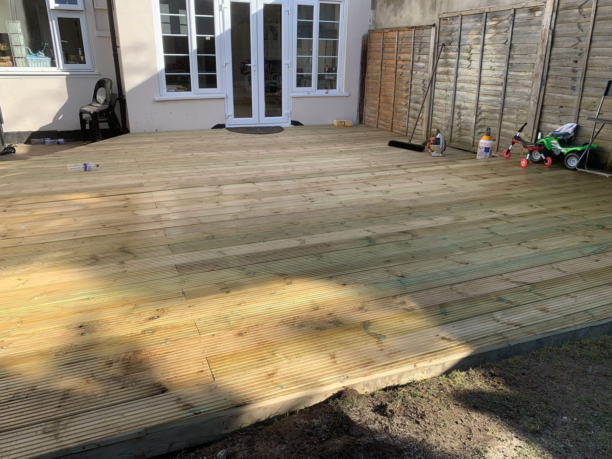 The deck nearing completion, with boards laid across the majority of the frame